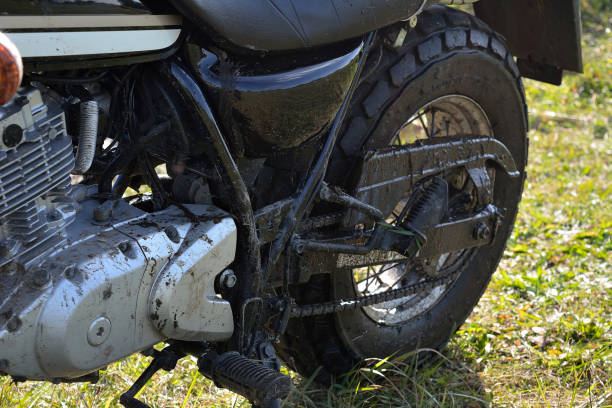 istock Off-road riding on a motorcycle - muddy bike 1421572597