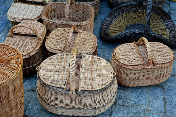 istock Plaiting wicker baskets, weaving of wicker baskets 1421573856