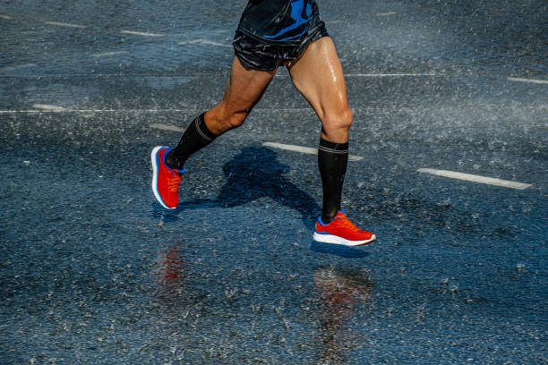 istock runner athlete running in summer rain marathon 1421574192