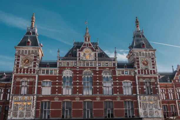 istock Amsterdam central train station in the summer time 1421577894