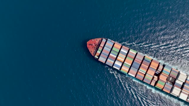 High aerial top view of a large container cargo vessel
