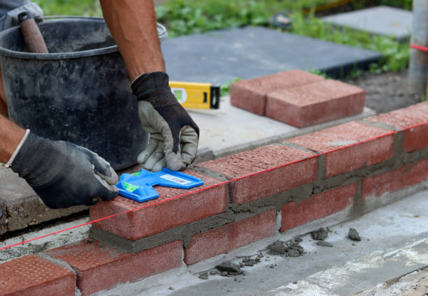 Builder working Construction work in progress. Male builder working with red bricks. Masonry wall close up photo. mason craftsperson stock pictures, royalty-free photos & images