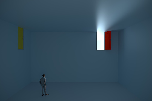 The concept of difficulty in reaching to success, doors on the top and a businessman, Blue background with copy space. Digitaly generated image.