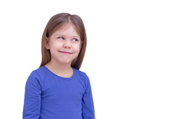 istock Smiling little girl looking aside at something 1421584733