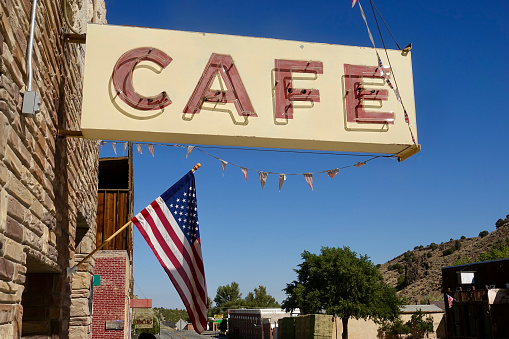 Sidewalk cafe sign with American flag