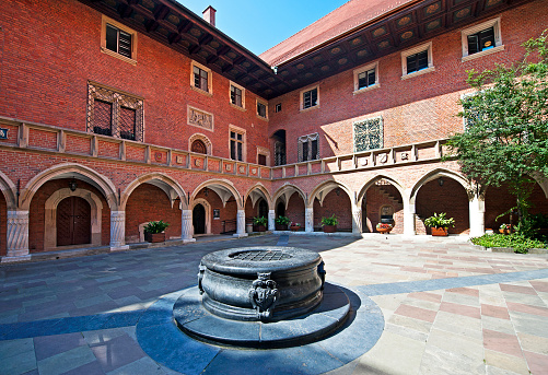 Jagiellonian University, Golebia, Old Town, Krakow, Poland. The old university buildings are now a free to enter courtyard with buildings that have been turned over to art installations. Krakow city in Poland was originally the capital of the country until 1956 but is now best known for its well-preserved medieval centre with its period architecture and spacious Rynek Glówny market square as well as the Jewish quarter and ghetto areas.