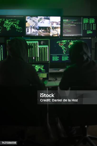 Firewall Hacker User Two Hooded Hackers Hacking Security Firewall Late At Night In Basement ...