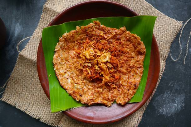 istock kerak telor or Egg Crust. kerak telor is Spicy Glutinous Rice Omelette with Grated Coconut. made from glutinous rice cooked, egg, serundeng, fried shallots and dried shrimp topping. 1421587904