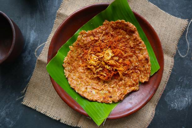 istock kerak telor or Egg Crust. kerak telor is Spicy Glutinous Rice Omelette with Grated Coconut. made from glutinous rice cooked, egg, serundeng, fried shallots and dried shrimp topping. 1421587906