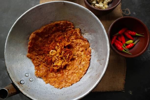 istock kerak telor or Egg Crust. kerak telor is Spicy Glutinous Rice Omelette with Grated Coconut. made from glutinous rice cooked, egg, serundeng, fried shallots and dried shrimp topping. 1421587916