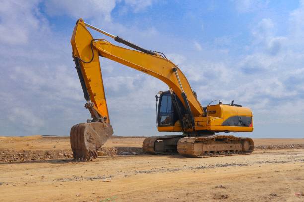 istock excavator or backhoe on construction site and sky background 1421588829