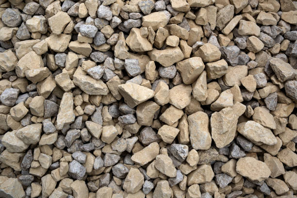 istock Building gravel, crushed stone, rock pieces. Construction material. Closeup texture and background, gray color. 1421589530
