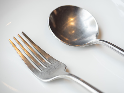 Fork and spoon on plate