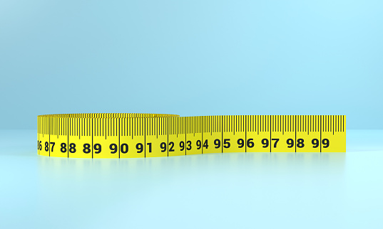 Tape measure on blue background