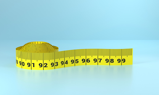 Tape measure on blue background