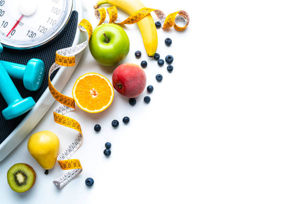 istock Health care: healthy fruits, exercising and weight control 1421598371