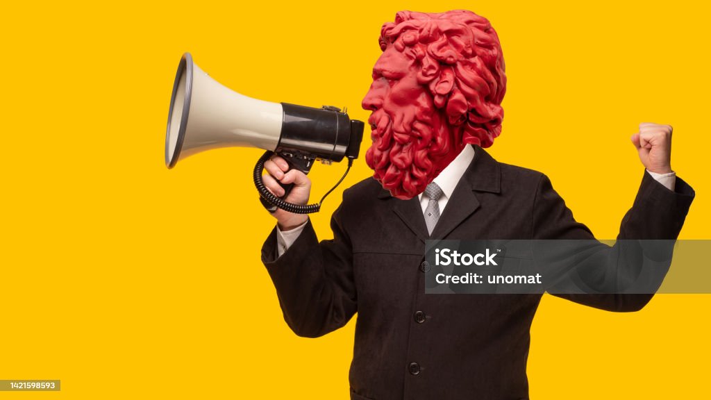 Abstract modern collage. The man with the plaster head of David with a megaphone on yellow background Megaphone Stock Photo