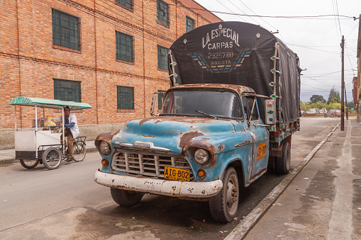 Bogota, Colombia - 09 Nov 2010: A rusty old blue van parked on a street in Mosquera, near Bogota