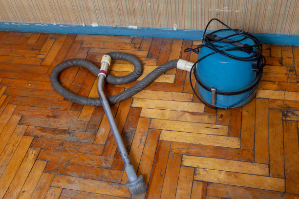 istock vacuum cleaner on parquet floor. View from above 1421601907