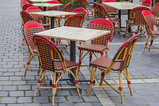 Wooden Tables With Rattan Chairs at Cobbled Street