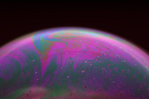 The abstact element on the soap bubble with the dark background.