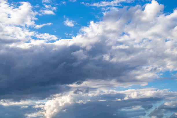 istock Dramatic blue sky and warm light clouds at sunrise time. 1421609669