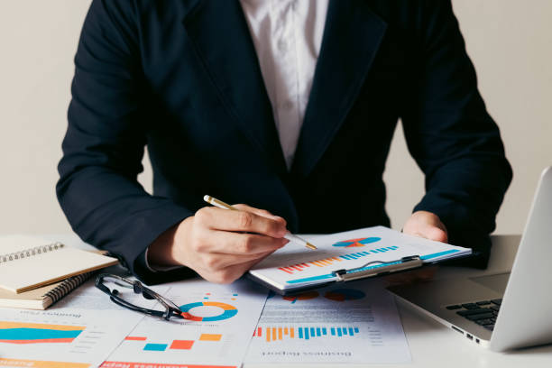 istock accounting concept. businessman working using a laptop with analyzing finance sales data and economic growth graph chart. 1421613360