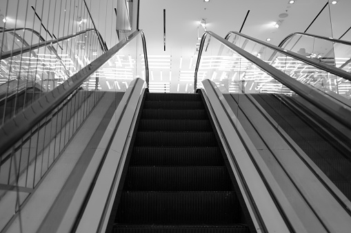 Escalators with electric lights.