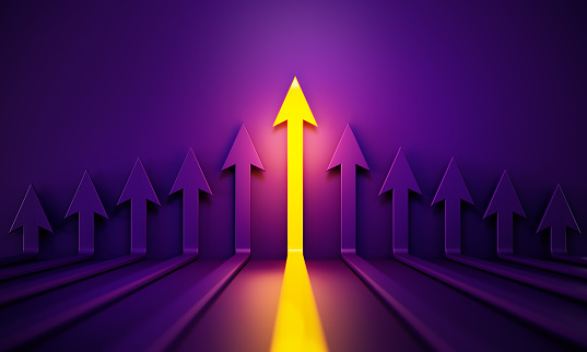 Yellow and purple arrows glowing before purple background. Horizontal composition with copy space.
