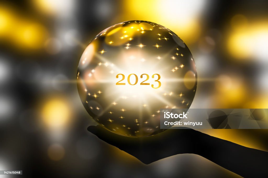 fortune telling 2023 with a crystal ball in a hand, festive atmosphere for happy new year party or award ceremony or other celebrations, 3d illustration 2023 Stock Photo