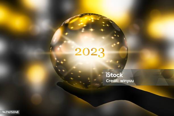Fortune Telling 2023 With A Crystal Ball In A Hand Festive Atmosphere For Happy New Year Party Or Award Ceremony Or Other Celebrations 3d Illustration Stock Photo - Download Image Now