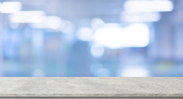 istock abstract blurred inside interior of modern hospital background with concrete texture tabletop for show and promote content or product on display 1421617541