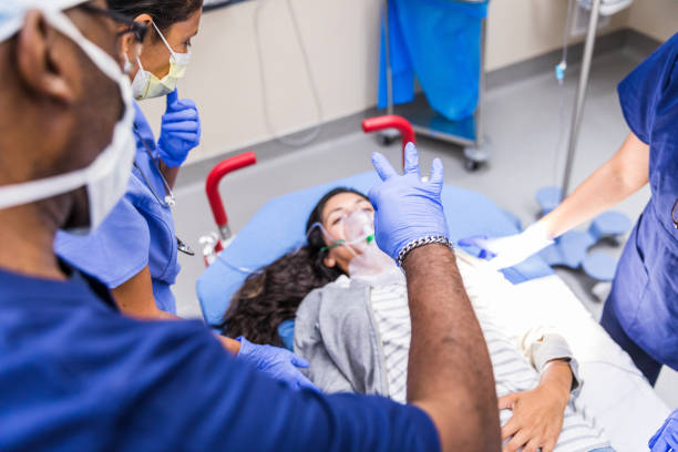 istock Over-the-shoulder view doctor checking patient awareness 1421620010