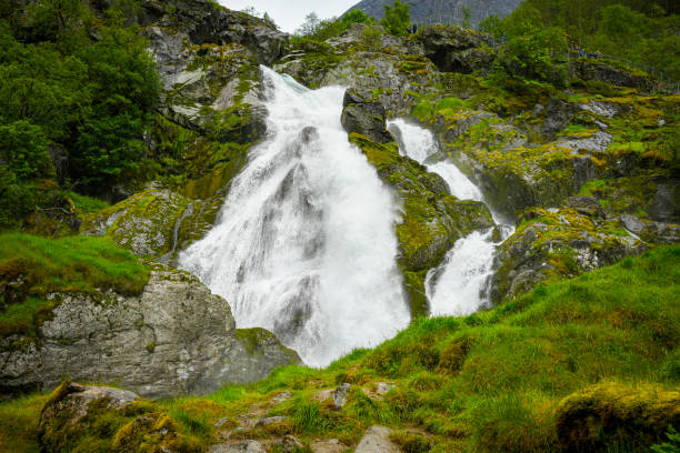 Waterfalls in the valley approaching Briksdal Glacier in Norway.