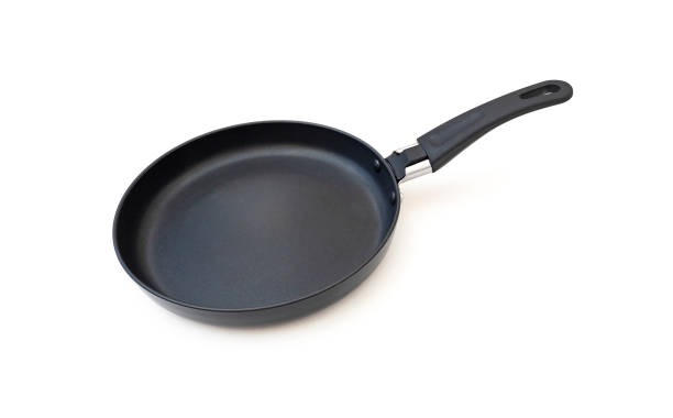 istock Empty black frying pan isolated on white 1421622888