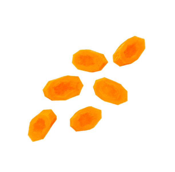 istock Round carrot slices falling isolated on white background 1421622925