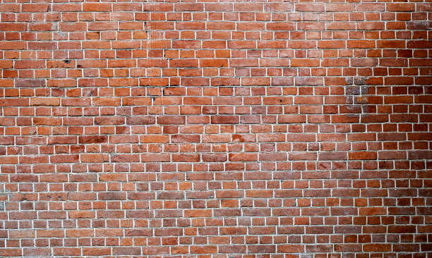 Urban background, long wall by old red brick in London as texture or background stock photo