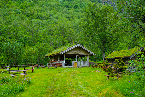Briksdal Glacier valley in Norway with a grass covered picnic area beside the road.