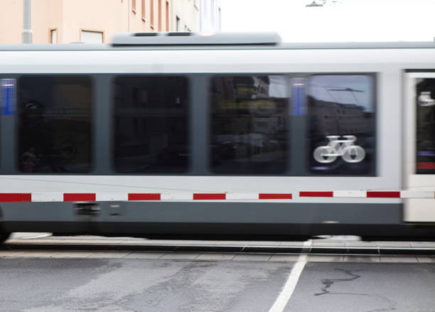istock railway crossing gate on the street 1421624606