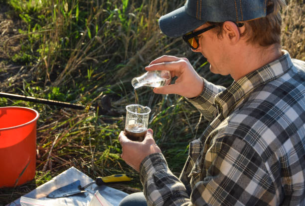istock Agronomy specialist testing soil sample labortory equipment outdoors 1421624658