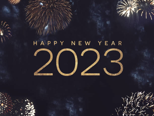 istock Happy New Year 2023 Text Holiday Graphic with Gold Fireworks Background in Night Sky 1421625426