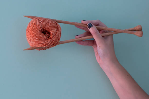 istock Woman hands holding a wool ball 1421626086
