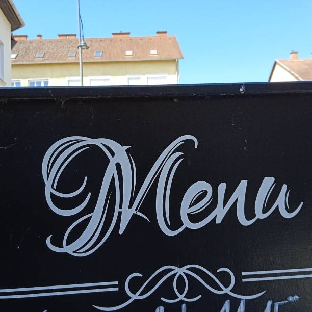 menu in a restaurant listing food and beverages offered to customers