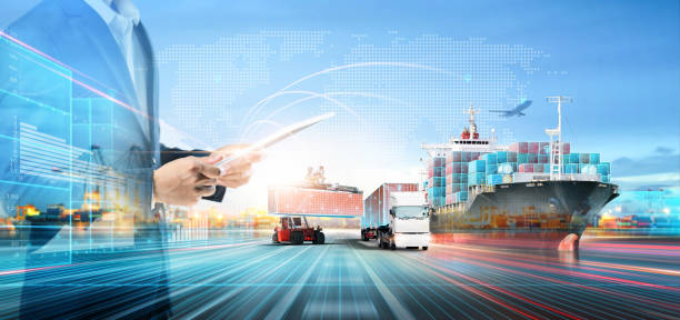 Business and Technology of Logistics Transport Concept, Double Exposure of Businessman using tablet control delivery network distribution import export on world map background, Future Transportation stock photo