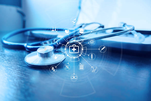 Stethoscope and laptop keyboard with icon on desktop in hospital,relax time doctor,medical concept,selective focus,vintage color.morning light stock photo