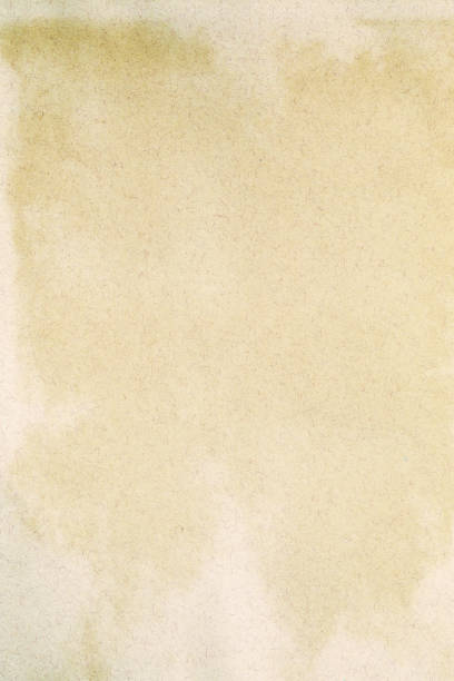 istock Old yellowed kraft paper with white stains 1421629468