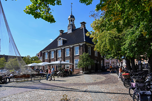 Empty cobblestone city street, surrounded by historic medieval buildings in the old town of Amersfoort. Holland in the Netherlands, Europe.