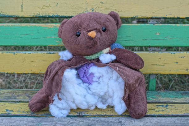 A plastic box of Teddy Bears at a thrift shop.