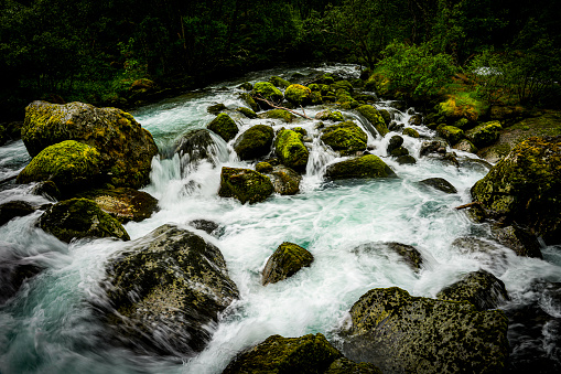 Meltwater river in the valley approaching Briksdal Glacier in Norway.