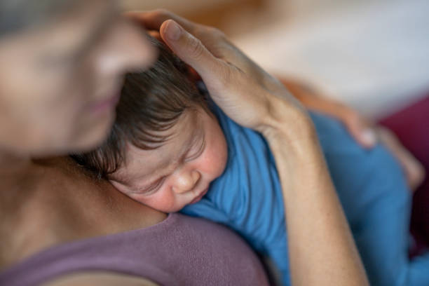 istock Newborn Resting On Momma's Chest 1421635155